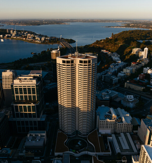 A birds eye view of buildings and a lake.